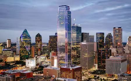 City skyline with illuminated office towers at dusk