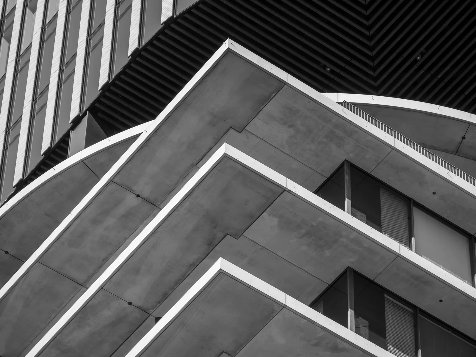 Layered geometric structure of a modern building in black and white